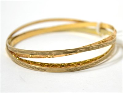 Lot 436 - Two 9ct gold bangles and two other bangles