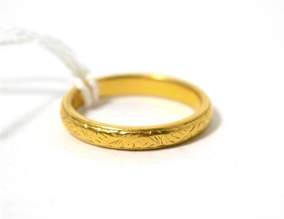 Lot 437 - A 22ct gold band ring, finger size O