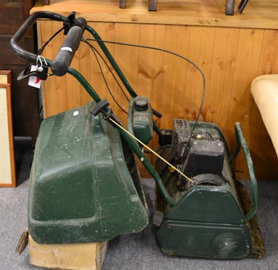 Lot 1014 - A lawn mower and scarifier