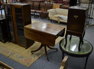 Lot 1050 - A 20th century oak glazed bookcase; an oval topped side table and a mahogany Pembroke table on...