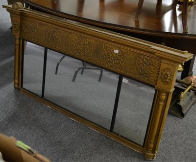 Lot 1093 - A sectional inverted breakfront over mantle mirror