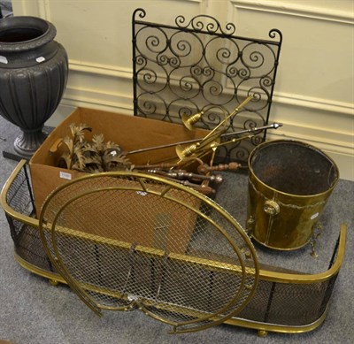 Lot 1100 - A quantity of fireside implements, spark guard, fender and a coal bucket