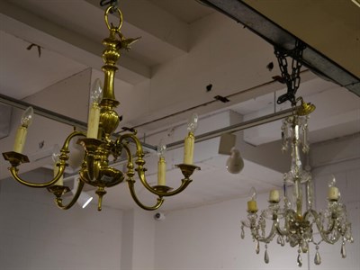 Lot 1104 - A brass five light chandelier together with a glass lustre drop five light chandelier and a six...