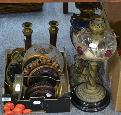 Lot 1130 - A brass oil lamp with glass reservoir, another oil lamp, a pair of brass and marble candlesticks, a