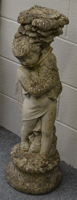 Lot 1137 - A composite stone statue of a girl with a fish, weathered