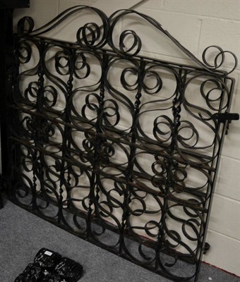 Lot 1142 - A pair of black painted mild steel gates