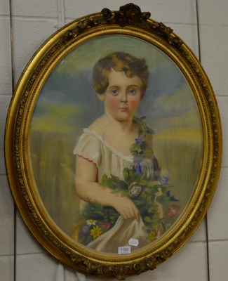 Lot 1150 - A pastel depicting a young girl holding a wreath of flowers, signed and dated 1862