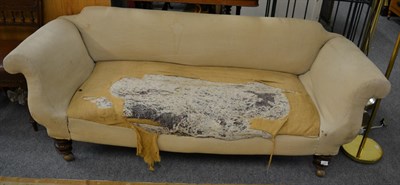 Lot 1155 - A Victorian scroll end sofa on turned legs