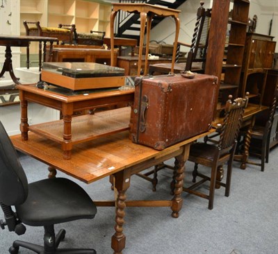 Lot 1168 - An oak drop leaf dining table, a modern glass top coffee table, an occasional table, a Bang &...