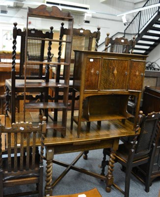 Lot 1169 - An oak drawer leaf table together with set of six matching chairs