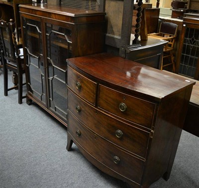 Lot 1170 - A George III mahogany three height chest of drawers and an astragal glazed mahogany bookcase