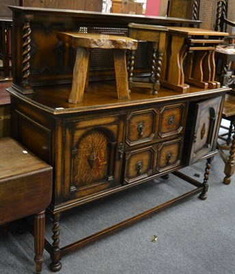 Lot 1171 - An oak cane backed sideboard