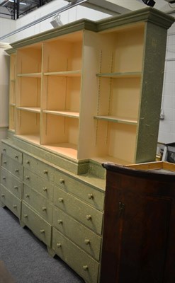 Lot 1181 - A painted breakfront bookcase cabinet