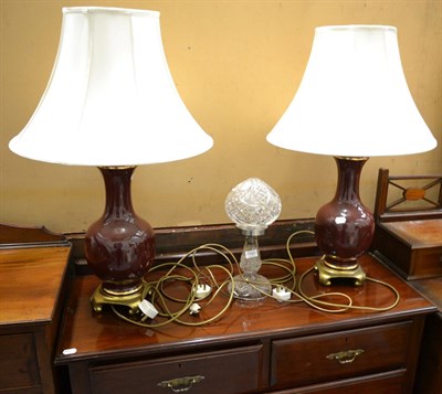 Lot 1185 - A cut glass mushroom lamp together with a pair of decorative table lamps with silk shades