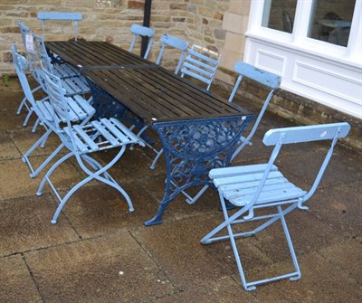 Lot 1191 - A pair of wooden slatted garden tables with blue painted cast iron supports, together with two sets