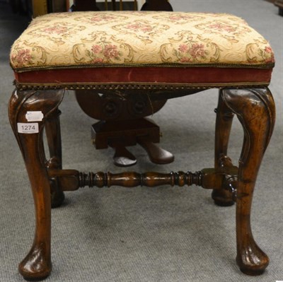 Lot 1274 - A reproduction walnut framed piano stool