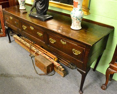 Lot 1277 - A George III oak dresser base