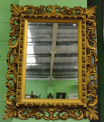 Lot 1285 - A reproduction gilt framed wall mirror