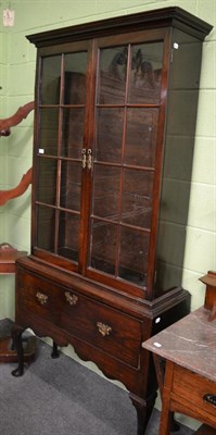 Lot 1287 - A 19th century mahogany glazed bookcase on stand