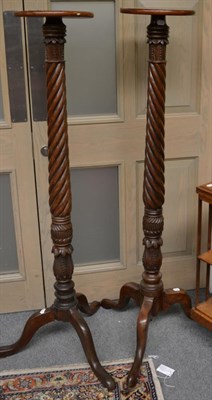 Lot 1292 - A pair of 19th century mahogany Wrythen-form torchere stands, on tripod bases, 51cm high (2)