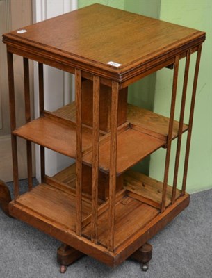 Lot 1293 - An early 20th century oak revolving bookcase