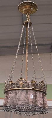 Lot 1298 - A leaf and scroll cast light fitting, suspended from six chains