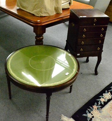 Lot 1321 - A Victorian mahogany wind out dining table raised on boldly reeded legs, together with a modern...