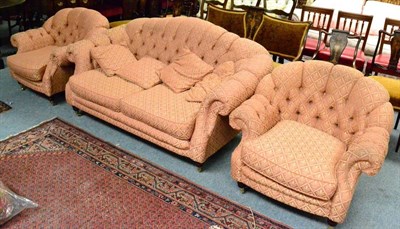 Lot 1337 - Buttoned hump back sofa with two matching armchairs