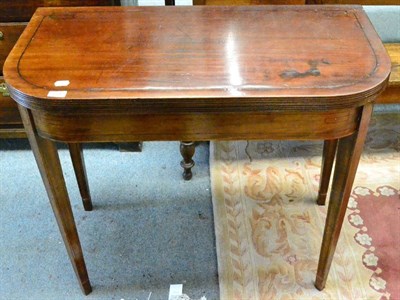 Lot 1345 - George III mahogany fold over tea table