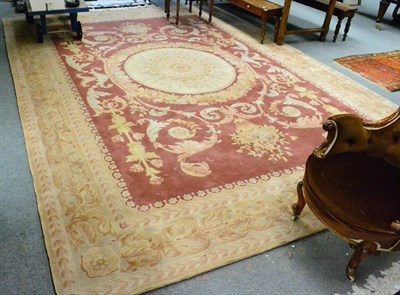 Lot 1346 - Savonerie design carpet, China, the field of scrolling acanthus centred by a roundel panel...