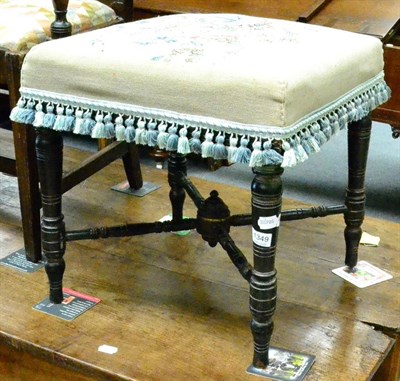 Lot 1349 - Mid 19th century parcel gilt ebonised turned stool with needlework seat