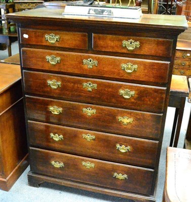 Lot 1351 - George III oak chest of drawers, two short over five long graduated