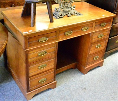 Lot 1352 - A late Victorian walnut desk, stamped James Shoolbred & Co, 123cm wide