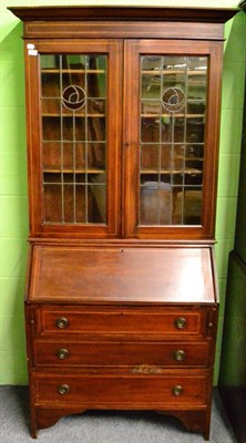 Lot 1389 - An Edwardian checkered, string inlaid mahogany, leaded and coloured glass bureau bookcase