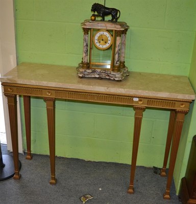 Lot 1394 - A reproduction marble top console table with gilt fluted stand