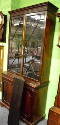 Lot 1400 - A mahogany astragal glazed bookcase decorated with blind fret work