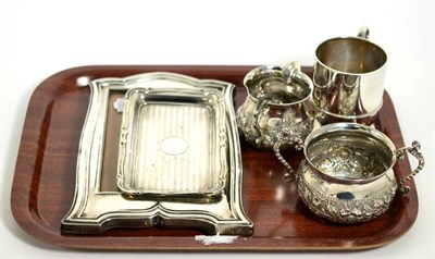 Lot 27 - Miscellaneous group of silver wares, including a photo frame, cream jug and sucrier and two...