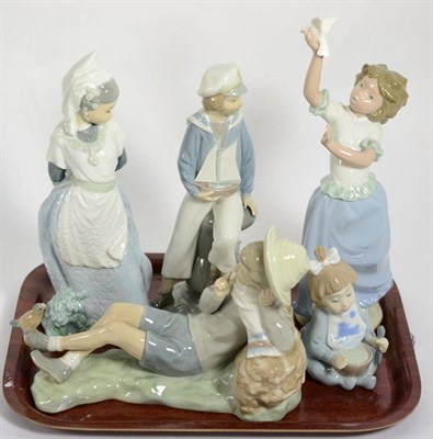 Lot 51 - Two Lladro figures of boys; and three Nao examples of girls