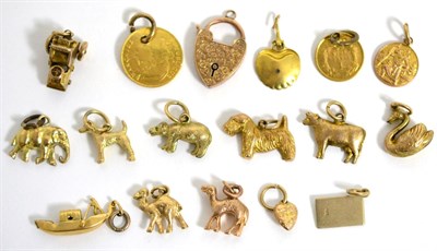 Lot 68 - A collection of sixteen charms and a padlock