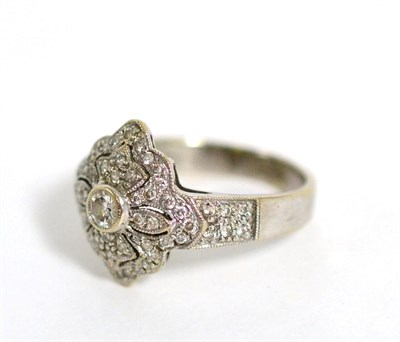 Lot 87 - An 18 carat white gold Art Deco style diamond ring, total estimated diamond weight 0.70 carat...