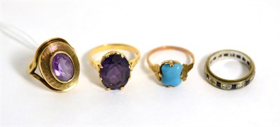 Lot 108 - Two amethyst rings, a turquoise ring and an eternity ring