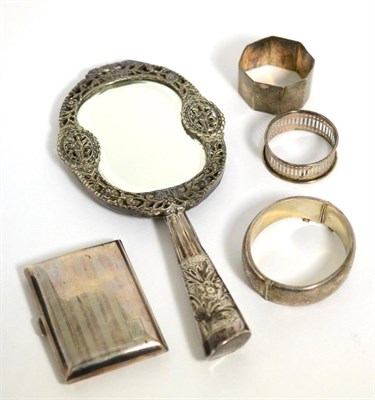 Lot 111 - A group of silver to include mirror; cigarette case; napkin rings etc