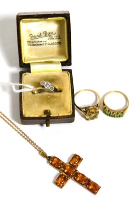 Lot 116 - A diamond ring, a citrine ring, a peridot ring and a citrine cross