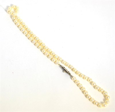 Lot 123 - Mikimoto cultured pearl single strand necklace, with a pearl set clasp, stamped with Mikimoto...