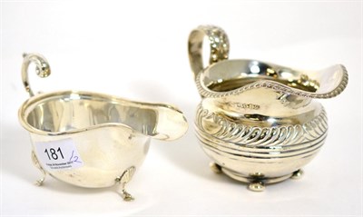 Lot 181 - A George III Regency silver cream jug, London 1819; and a modern silver sauce boat by Deakin &...