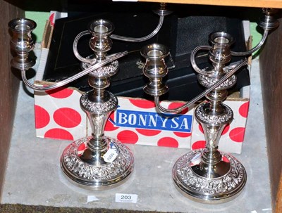 Lot 203 - A pair of silver plated three light candelabra; together with various boxed flatware