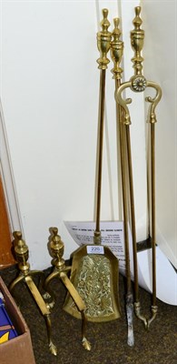 Lot 220 - A three piece brass companion set with a pair of andirons (5)