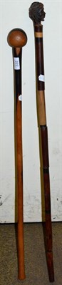 Lot 222 - African hardwood knobkerrie and a hardwood walking stick with carved figured head (2)