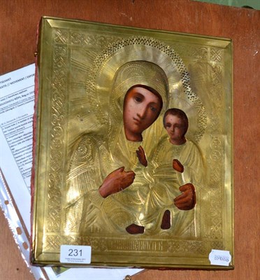 Lot 231 - A late 19th / early 20th century Russian icon with gilt metal oklad, 'The Mother of God of...