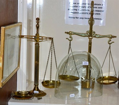 Lot 232 - Two brass balance scales; a glass dome and an embroidered pole screen (4)